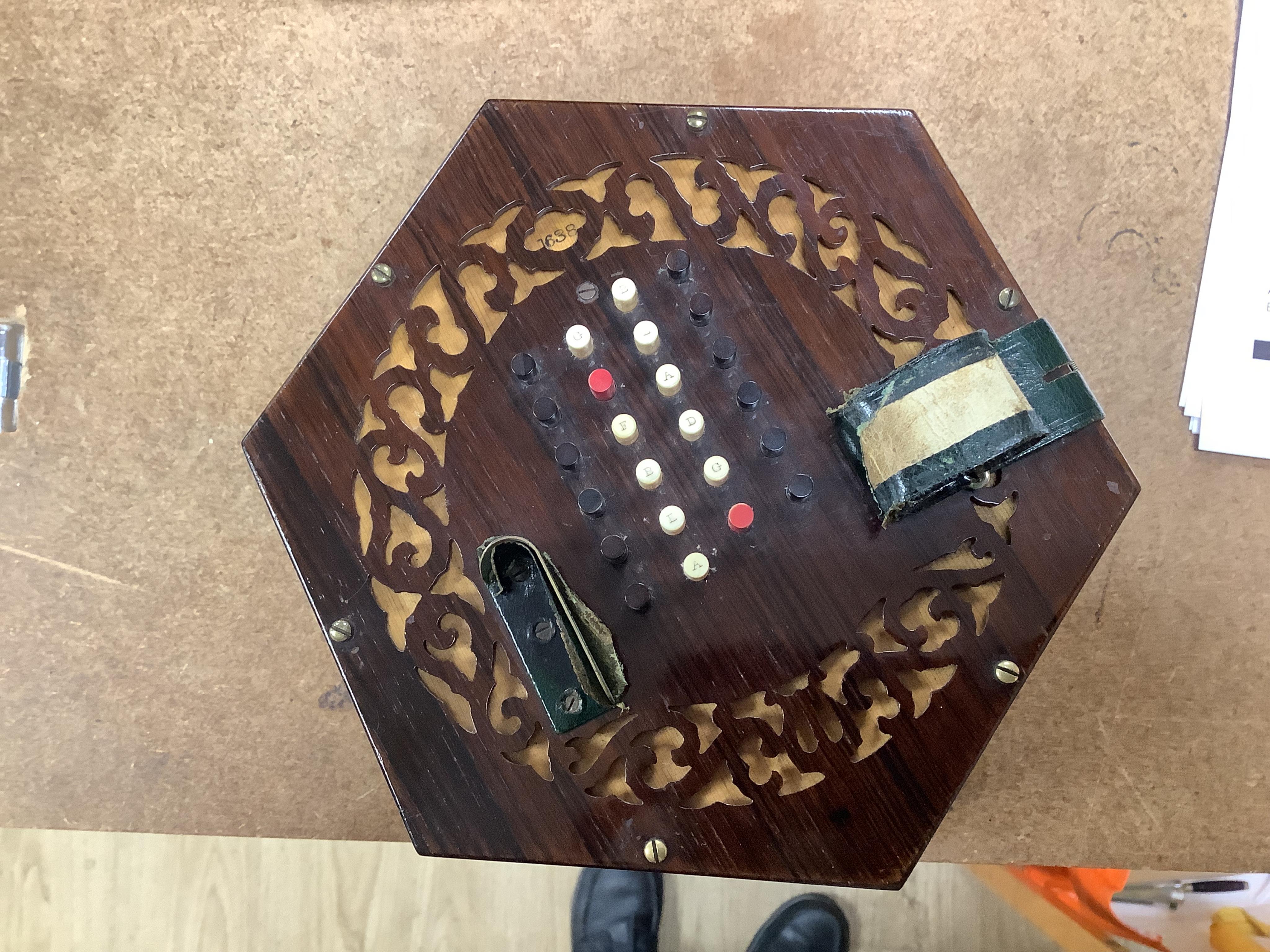 A Wheatstone concertina, in rosewood case, case 16.5cm high. CITES Submission reference, PS7AQEEA